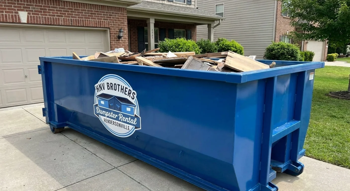 A HNV Brothers Dumpster Rental roll-off dumpster staged for a job near Fletcher, NC
